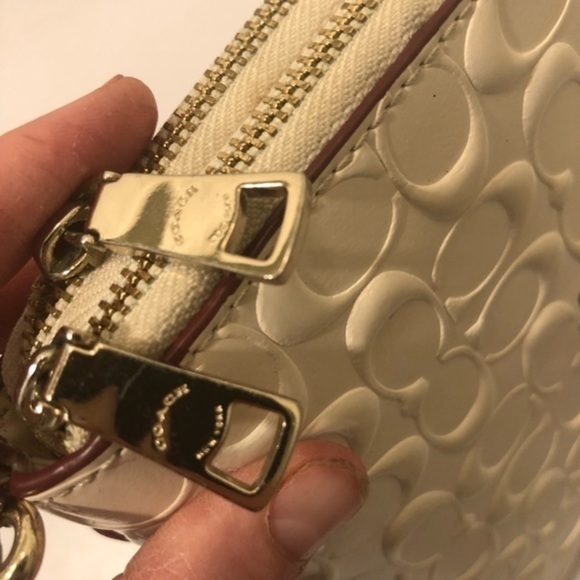 Coach debossed creamy white double zipper wristlet